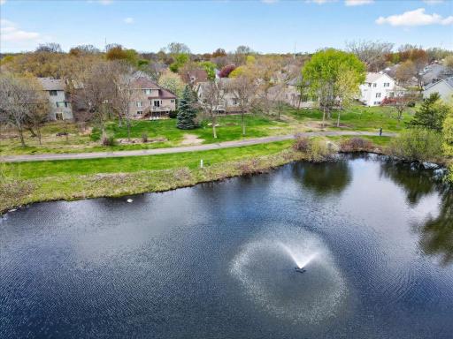 The home backs to this scenic pond and a private neighborhood park with playground is just steps away.