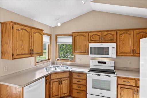 Multiple kitchen windows provides great natural light. Newer kitchen appliances too!