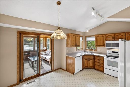 The kitchen walks out to the three season porch and has an informal dining space.