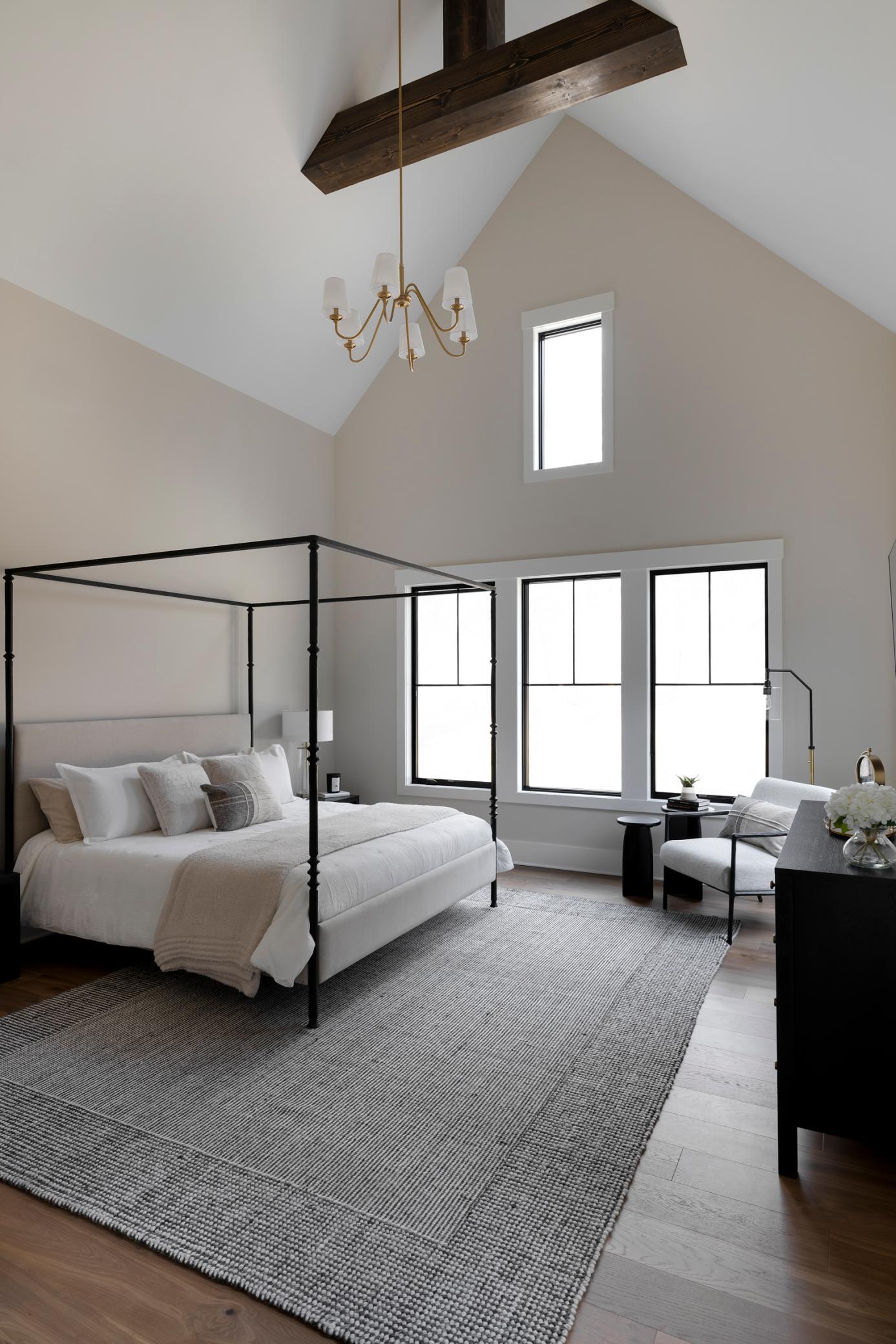 Primary Suite with tall vaulted ceilings & wood beams