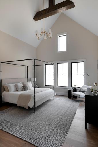 Primary Suite with tall vaulted ceilings & wood beams