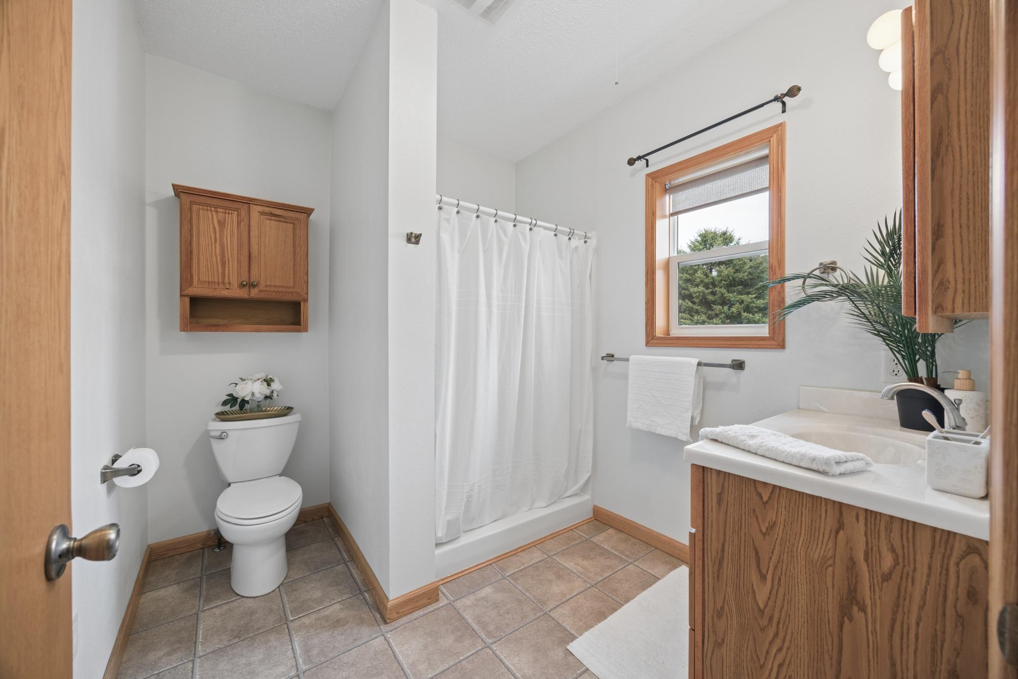Main floor 3/4 bathroom just inside the back entry so it's close to the backyard and deck.