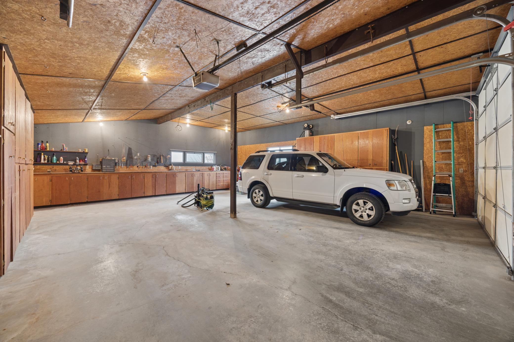 Check out the cabinets, the work bench and all the storage space.