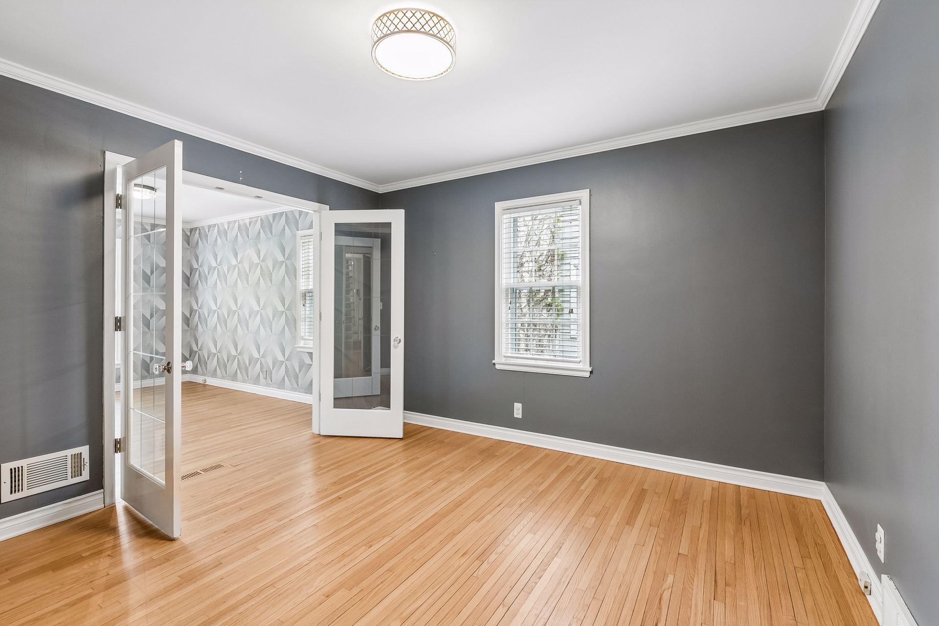 Main level bedroom looking towards office