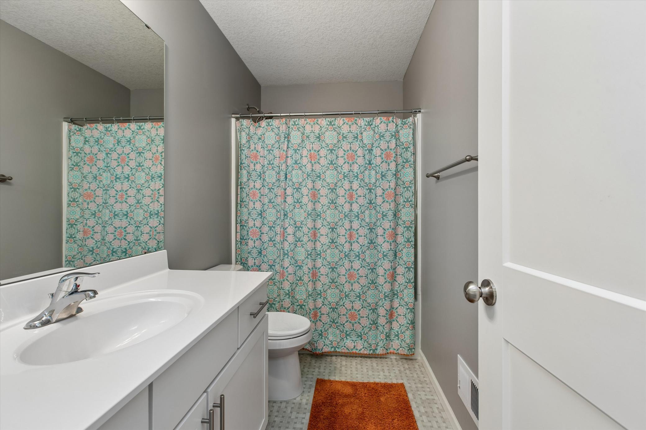 Upper level full bath to accommodate other bedrooms