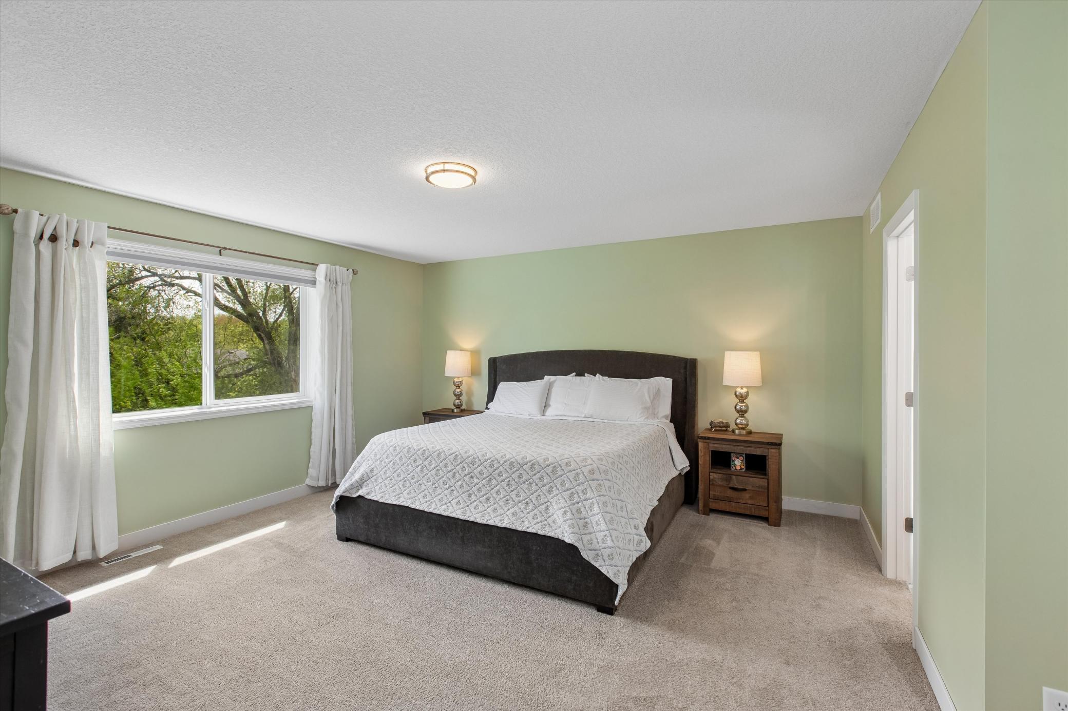 Primary bedroom with ample room for full-sized furnishings