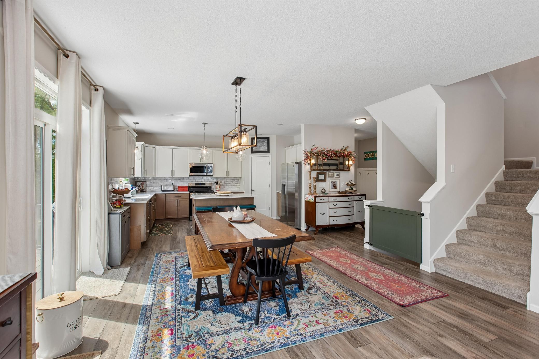 Main living area with stairs going to upper and lower levels