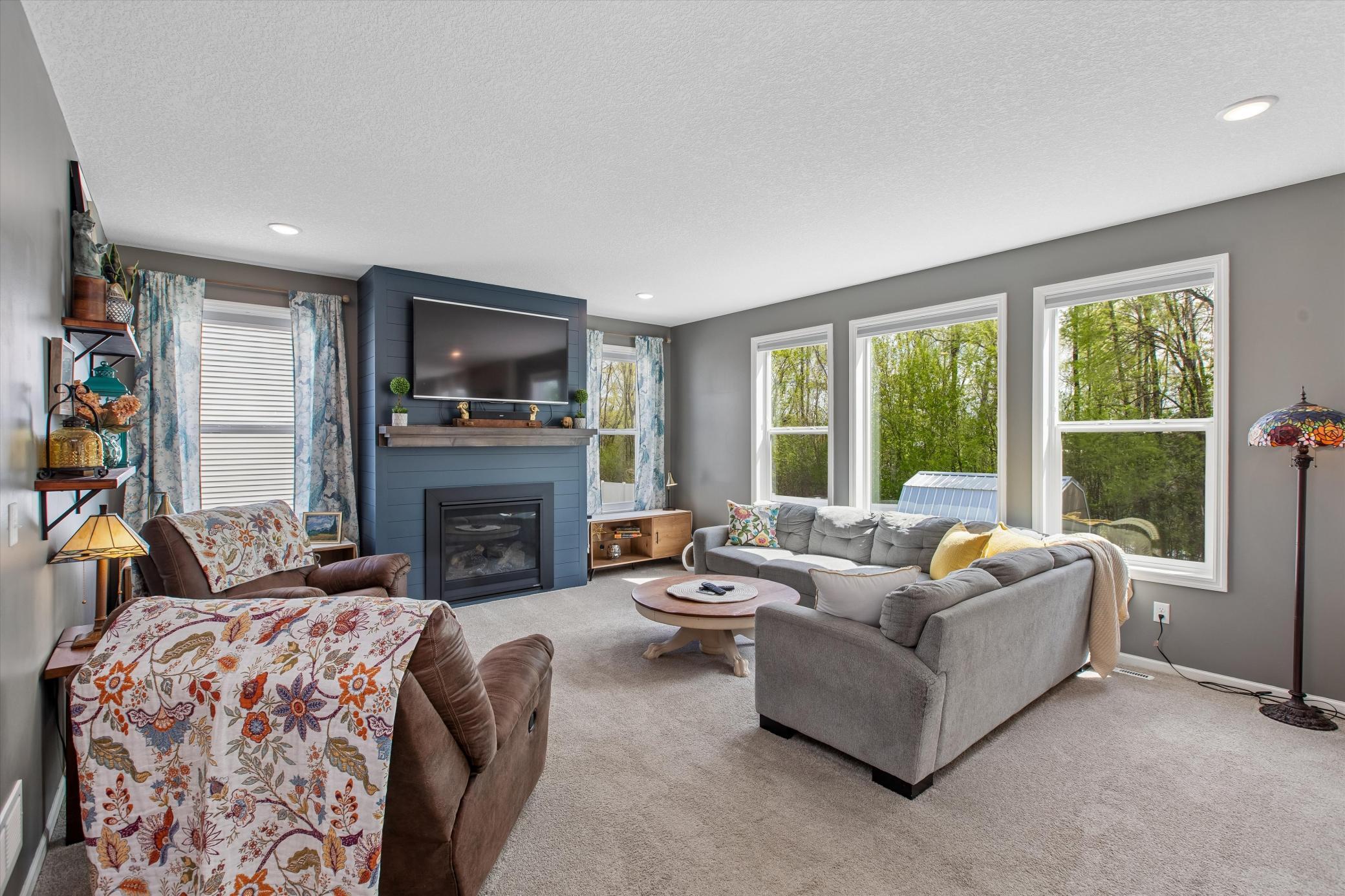 Walls of windows in living room keep this room bright