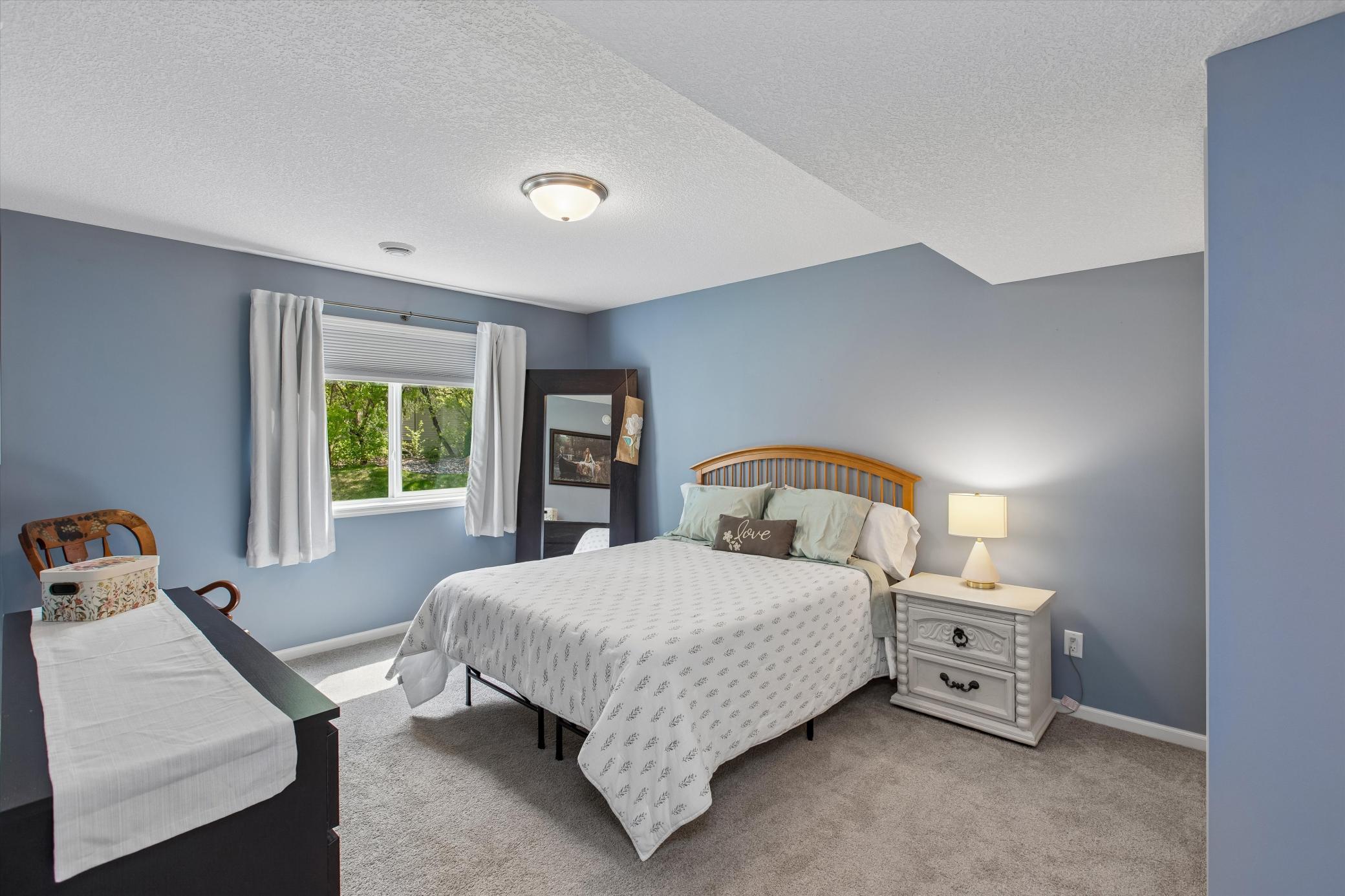 Backyard facing lower level bedroom