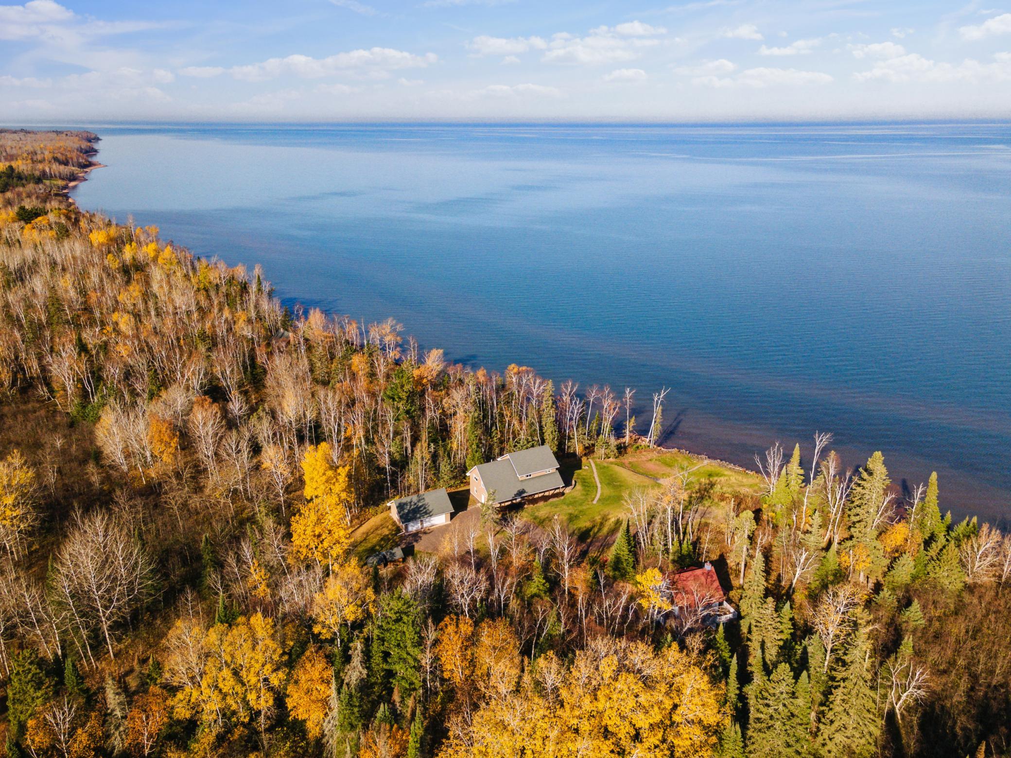 Look at this setting on Lake Superior! Home sits on 3.45 acres with 150 feet of gently sloping elevation to the lake. Imagine in the warmer months with this snow gone!