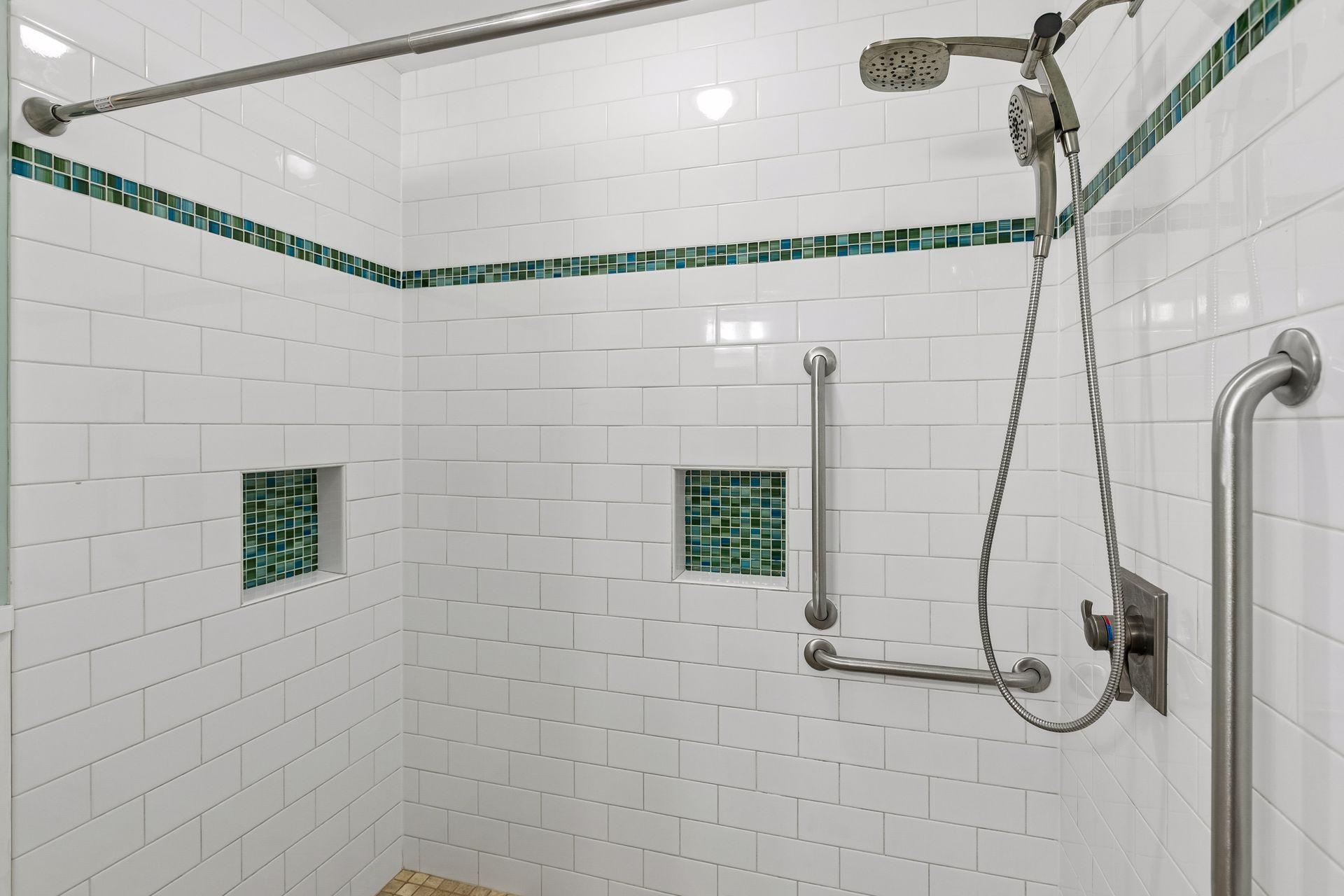There is a large shower here with beautiful tile work.