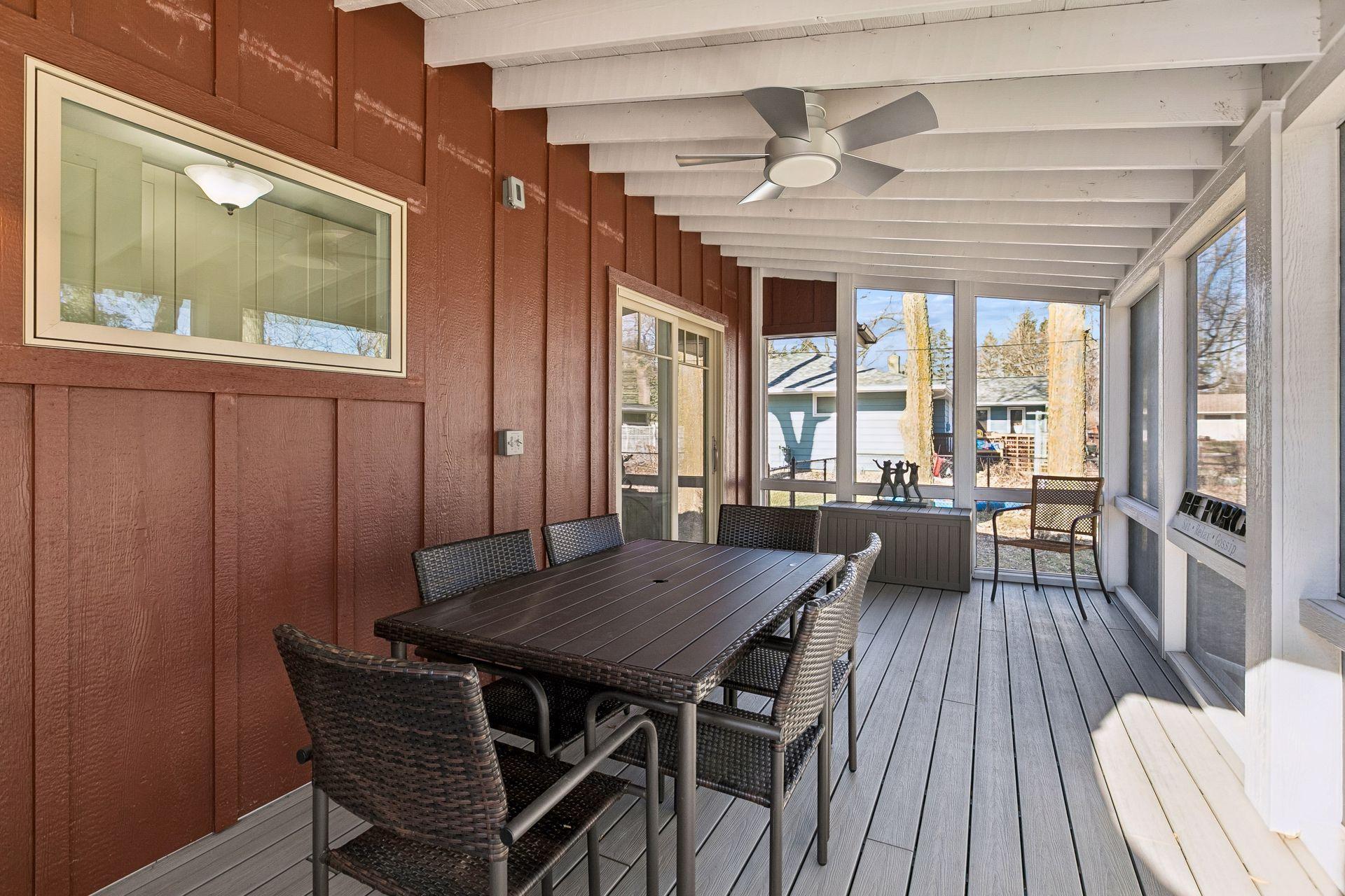 Off of the kitchen and main bedroom is this absolutely to die for back screen porch!