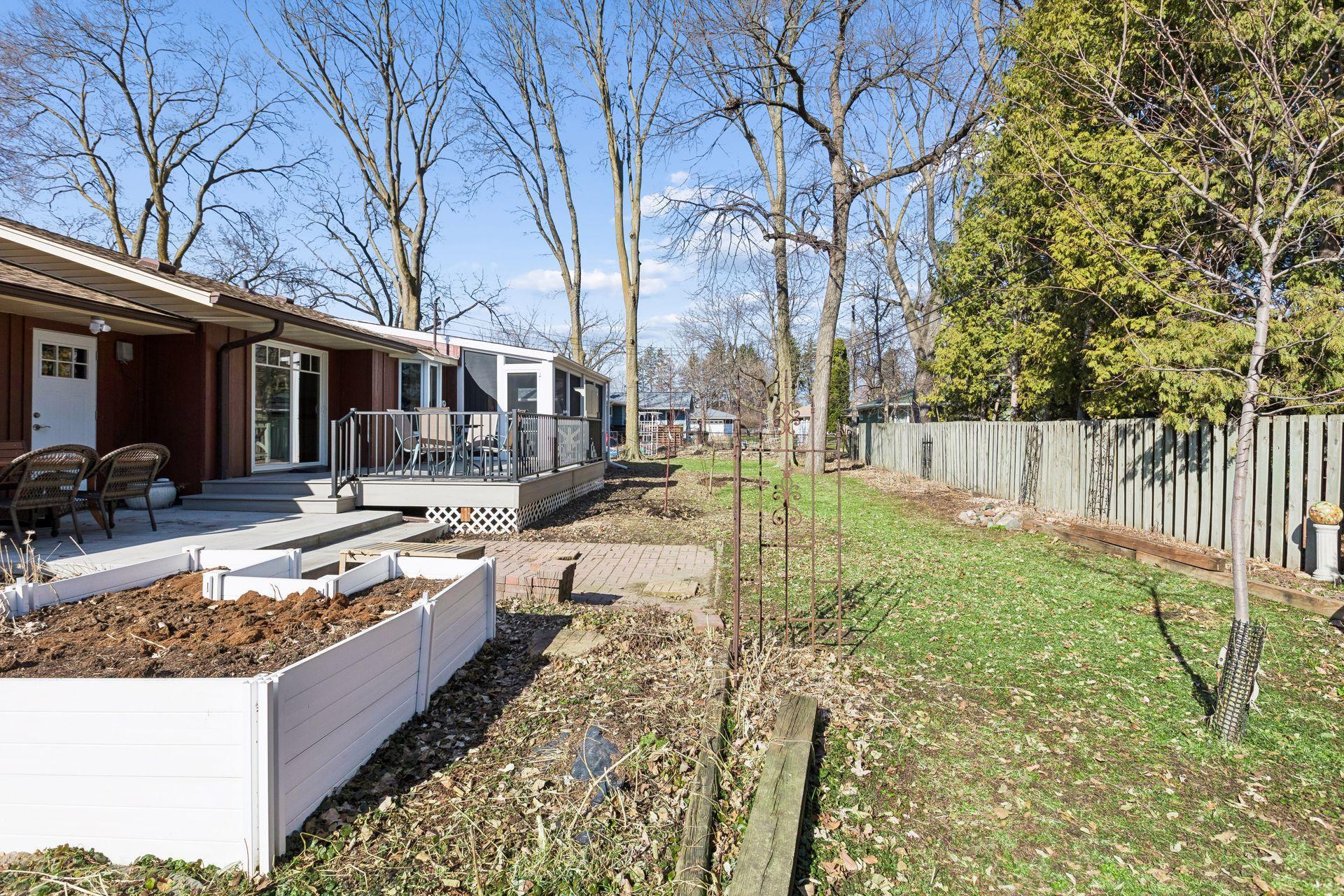 The backyard is flat, level, and lush.