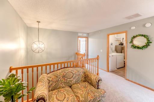 Laundry room conveniently located on same level as bedrooms.