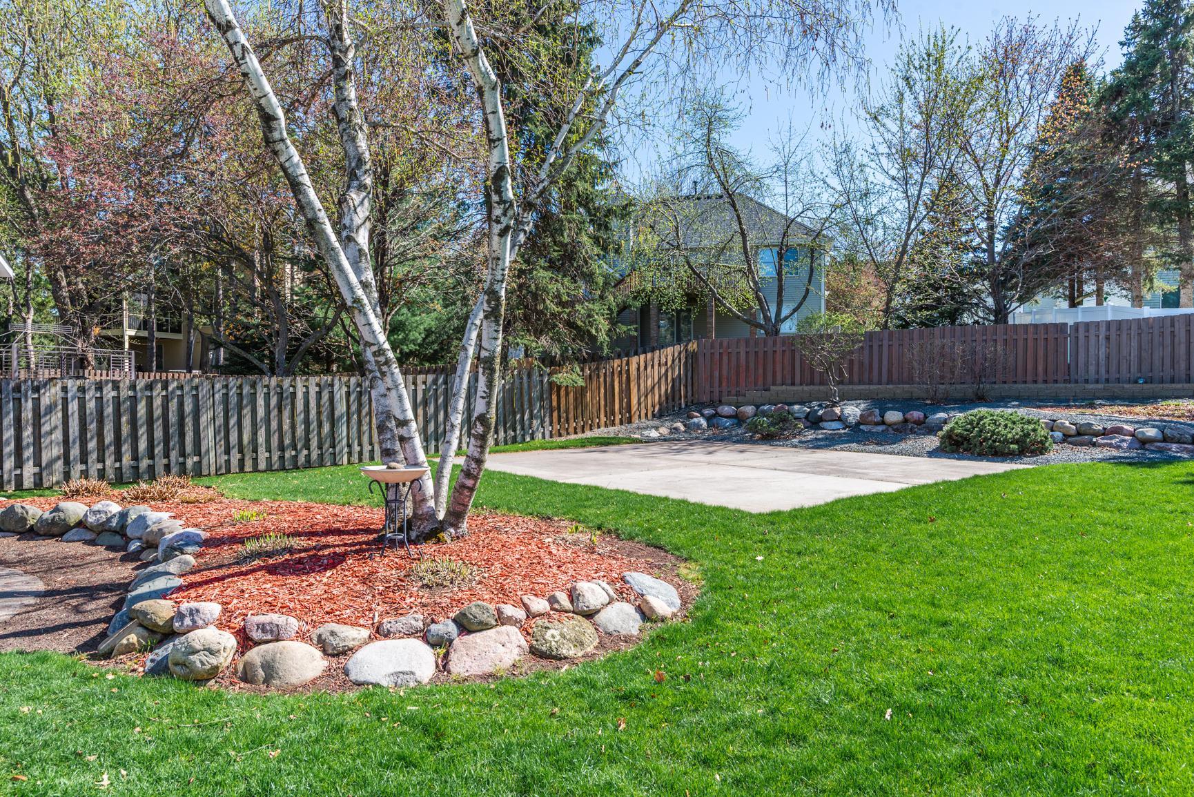 Recreation Slab - 28' x26' placed off to the side of the yard, leaving ample green space