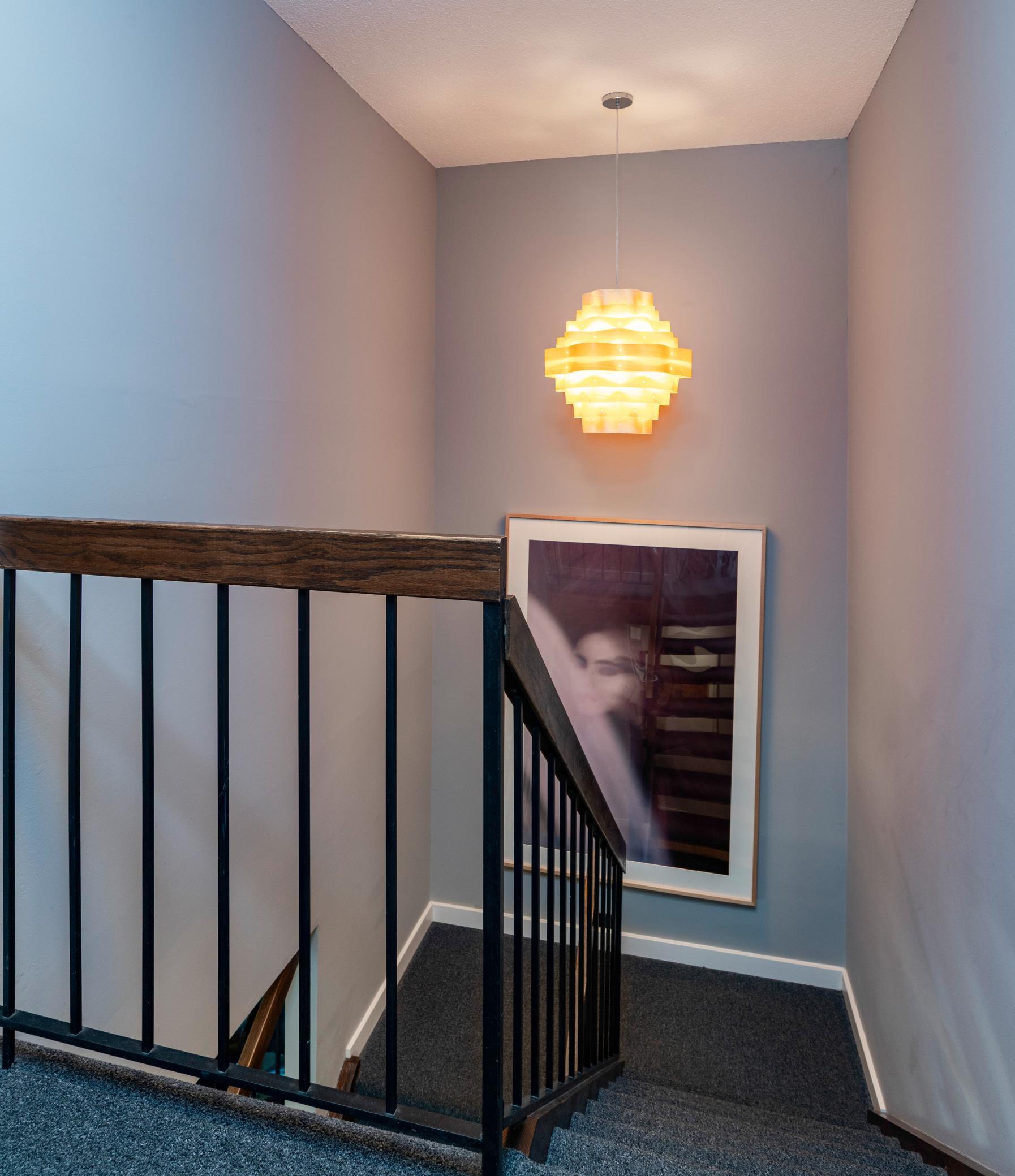 Open staircase leads to upper level bedrooms and baths.