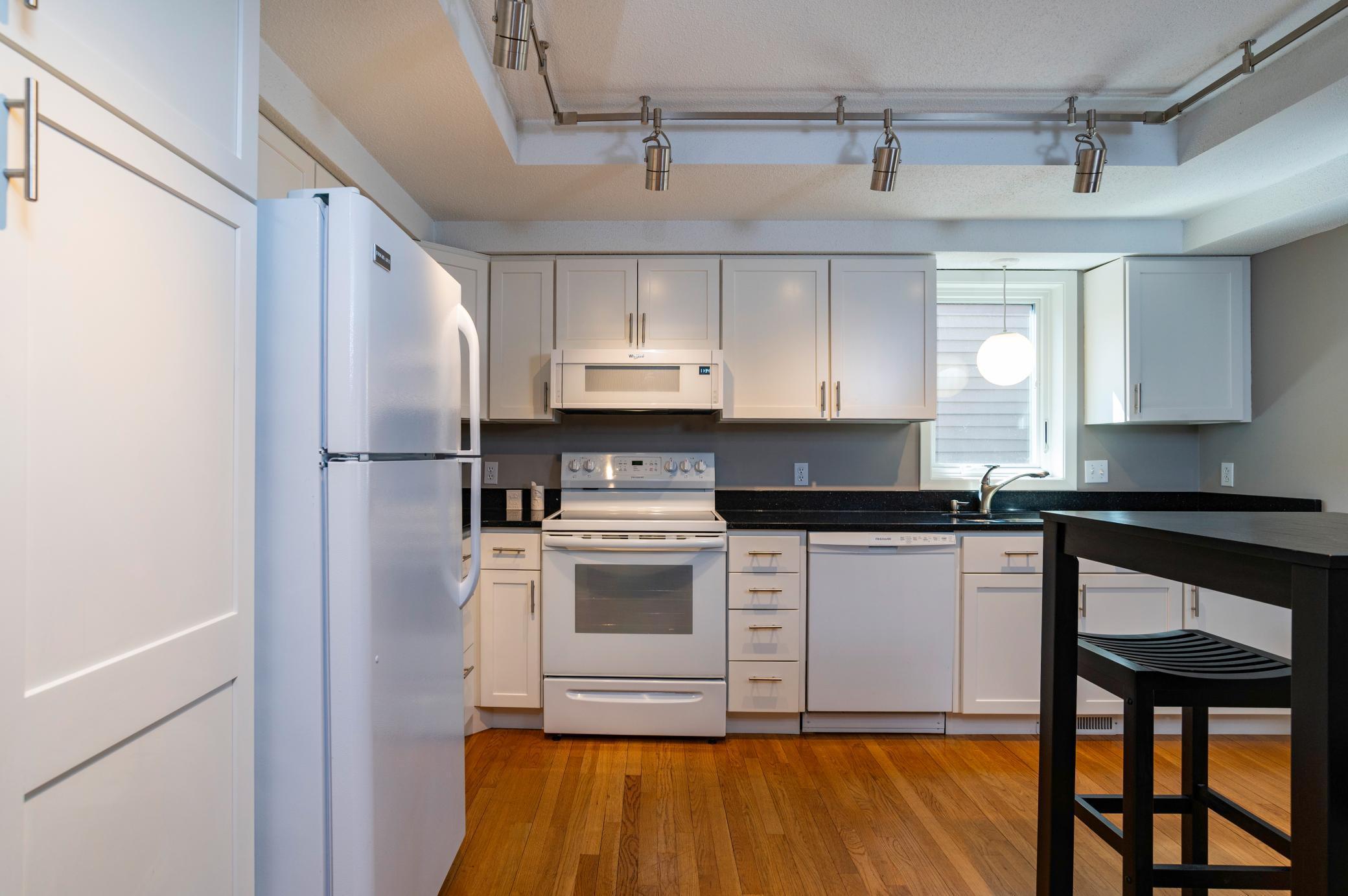 Spacious remodeled kitchen in 2021 has all newer appliances, abundant cabinet space and storage.