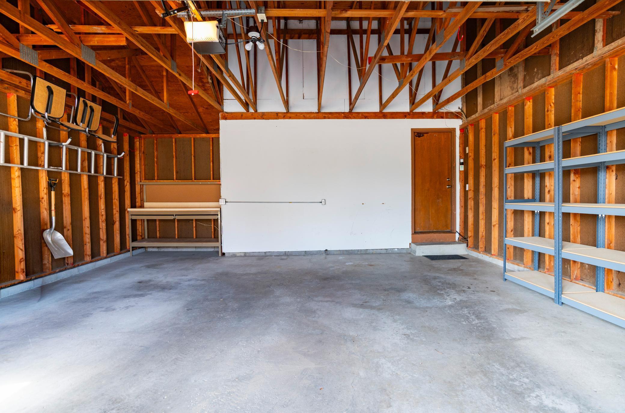 Spacious 22 x 22 garage with shelving for storage. Direct access to main level of home.