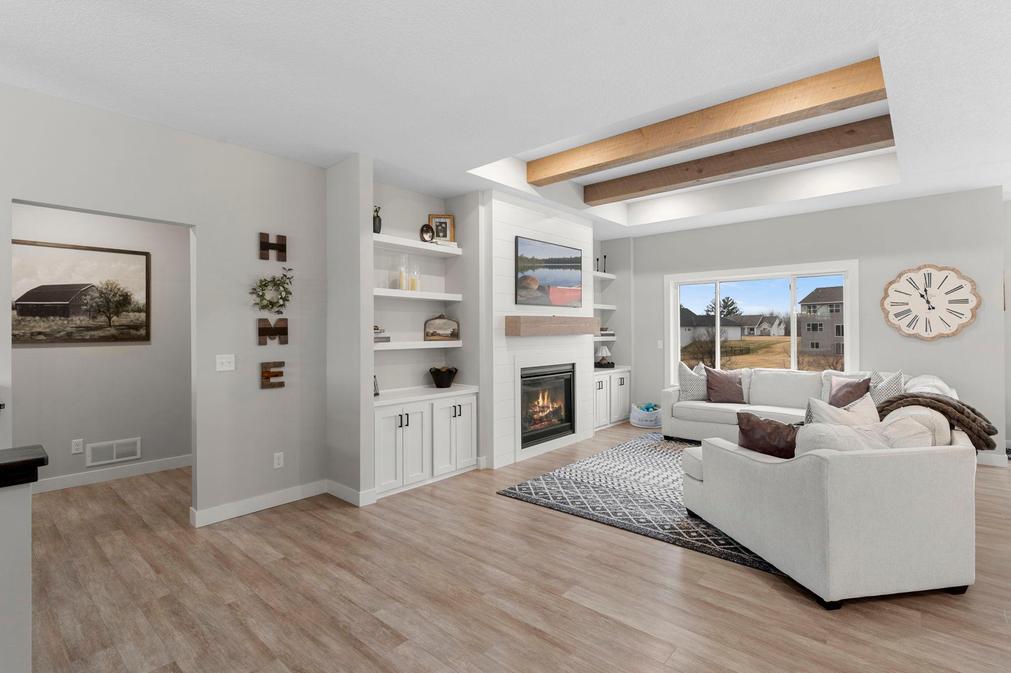 View into living room from front door entrance near staircase.