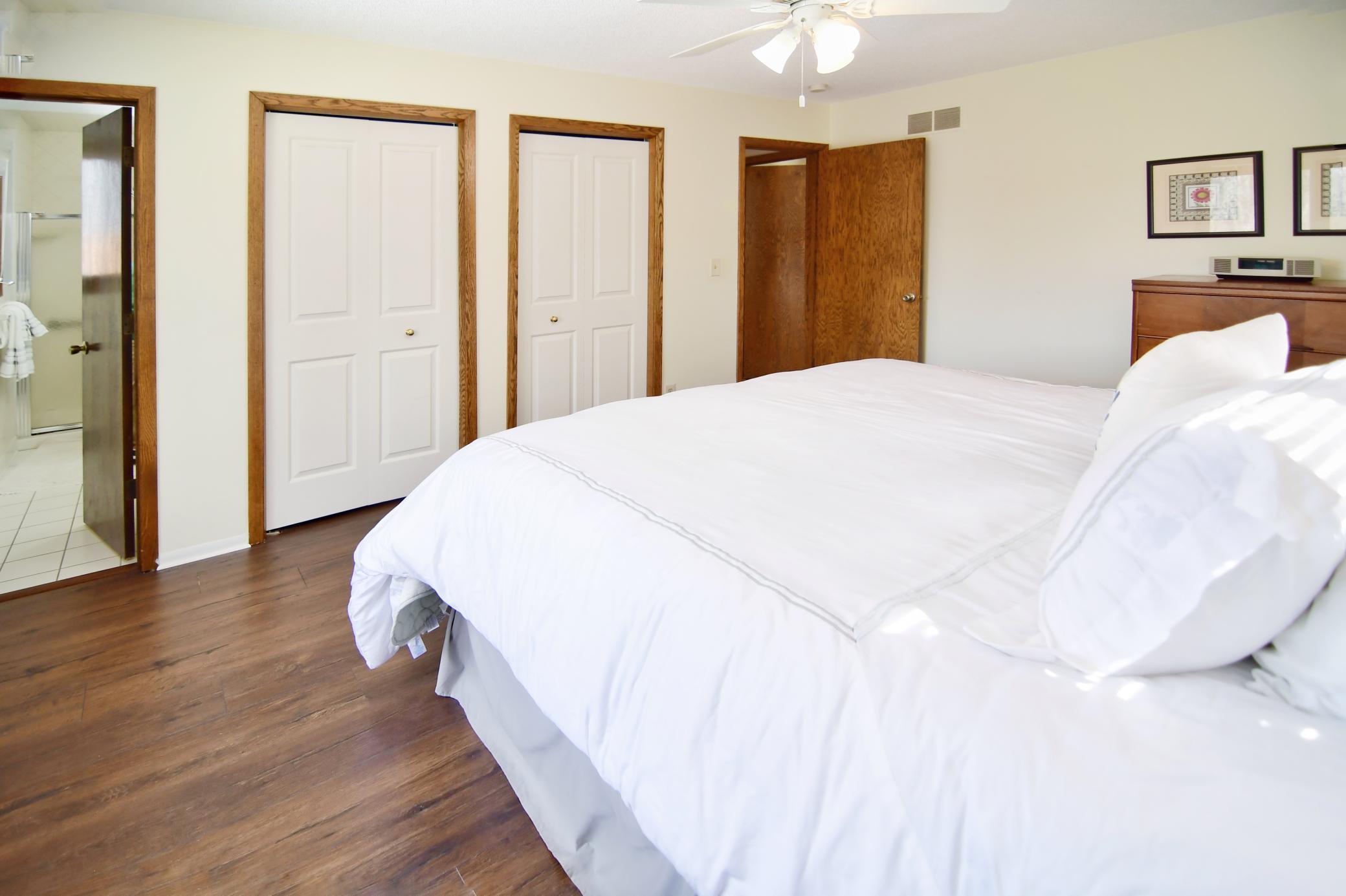 Nice floors, double closets and a ceiling fan w/ light serve the Owners of this dwelling.