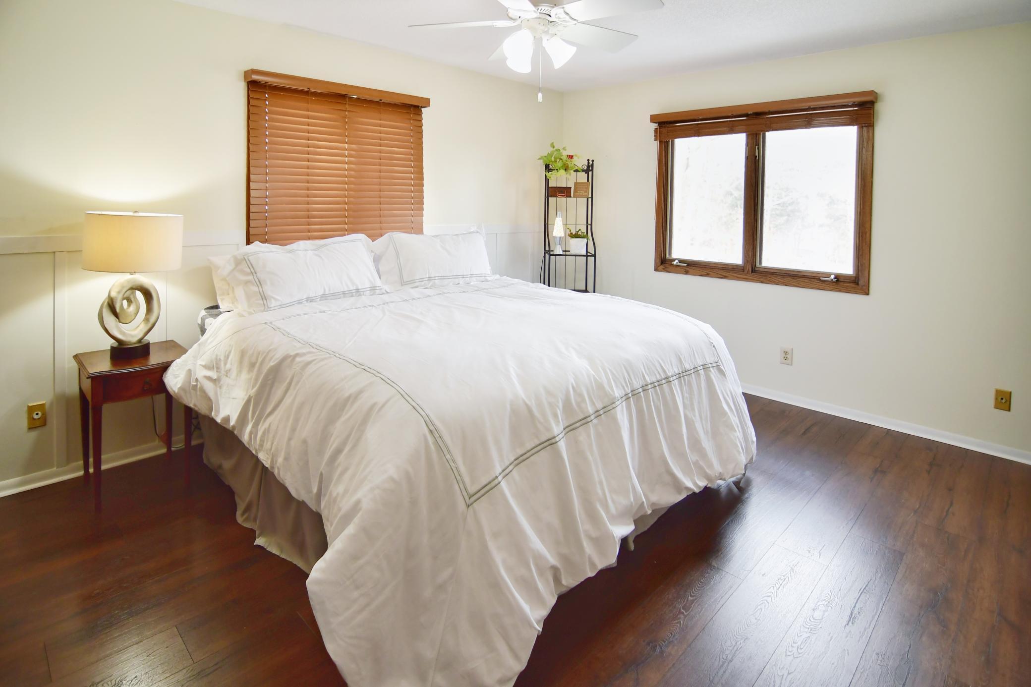 Owners' bedroom is spacious and accommodates a king size bed and other furnishings. Blinds included for privacy.