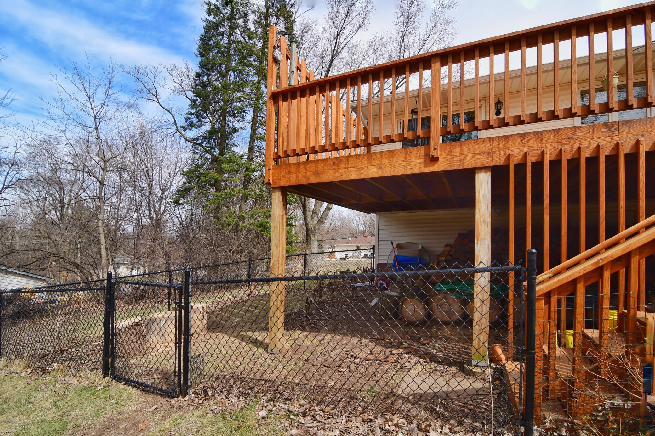 Black fencing and door was installed to keep items and a furry pet inside.