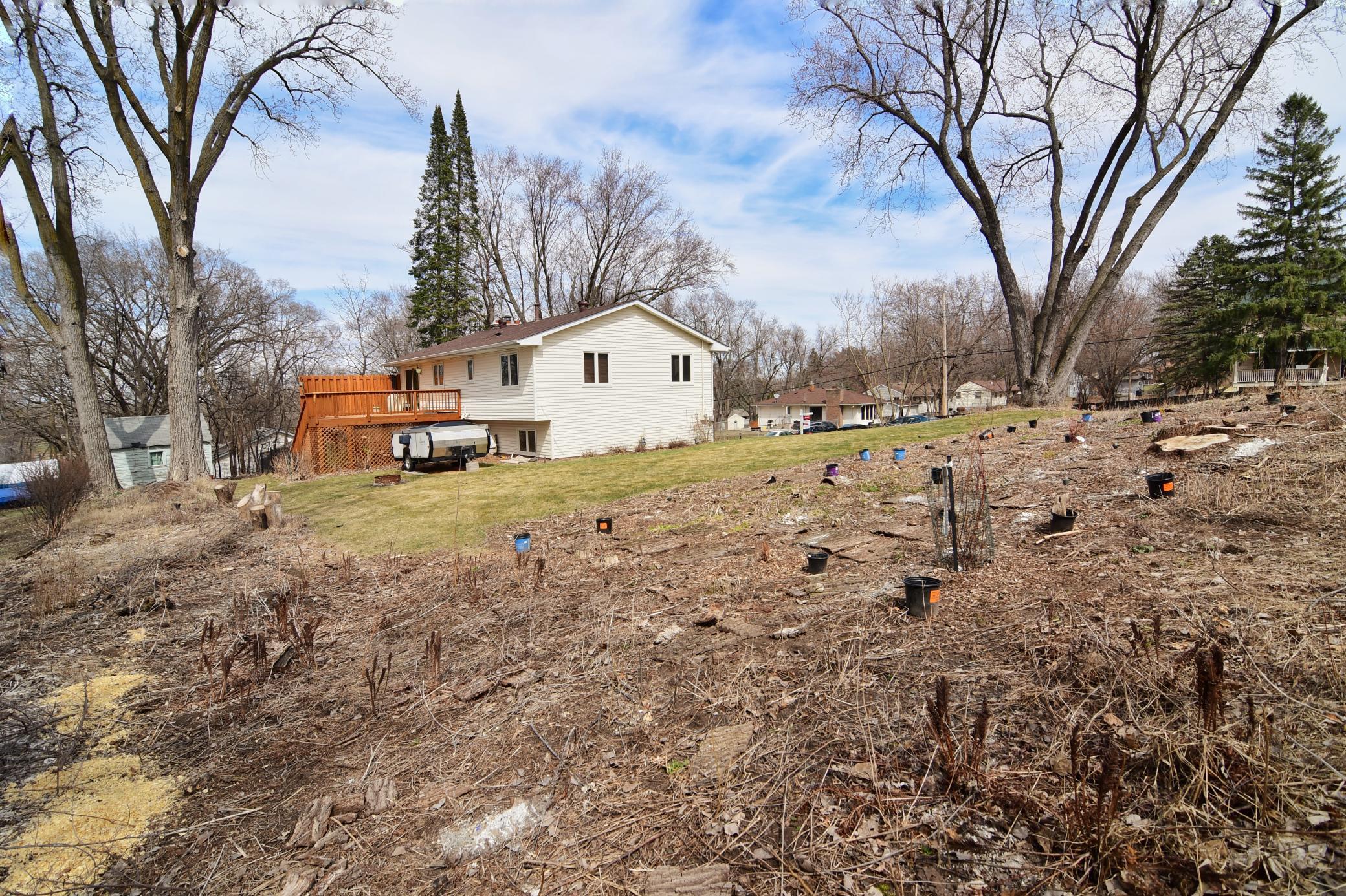 Huge yard features a hobby garden preparing to bloom soon.