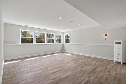 The Ultimate Entertainment Hub. This newly refinished, expansive open-concept living area offers endless possibilities