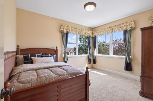 This comfortable bedroom is tucked away for maximum privacy, making it the perfect quiet zone for sleep or study