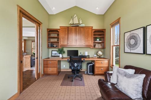 Versatile flex space ideal for an office, library, or creative studio. Features premium cherry built-ins, an integrated desk, and elegant French pocket doors. Enjoy abundant natural light or total privacy with custom shades
