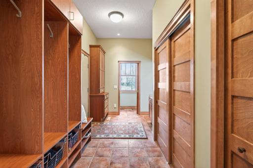 Generously sized mudroom designed for everyday ease, featuring abundant storage to keep everything neatly organized and within reach