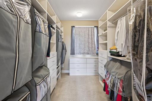 Well-appointed walk-in closet designed to keep everything effortlessly organized and within reach
