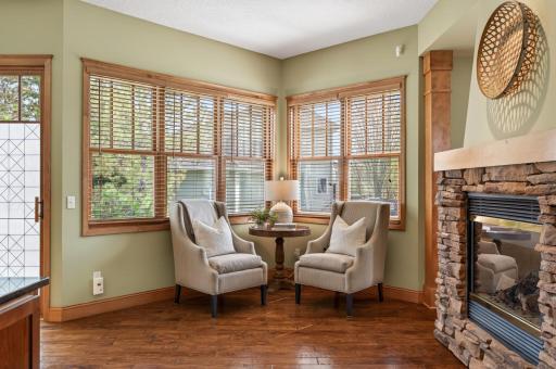 Charming kitchen nook offering an intimate sitting area bathed in natural light, perfect for casual conversations or quiet moments