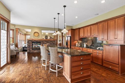 Exquisite hand-carved, distressed plank flooring that showcases rich texture and artisanal character, adding warmth and timeless charm to the space