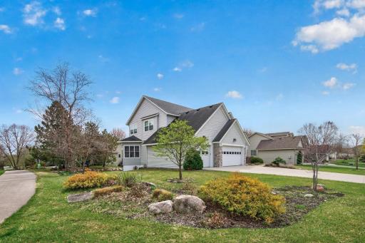 Beautiful perennials enhance the landscaping, offering texture and low-maintenance curb appeal throughout the seasons