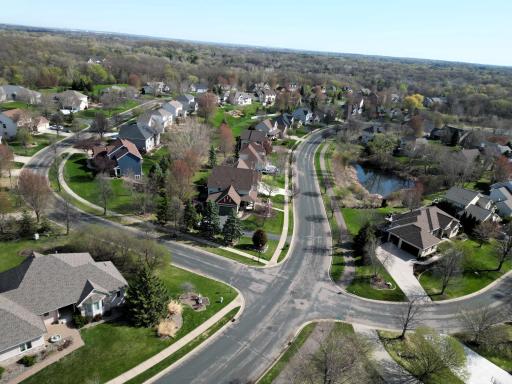 This bird’s-eye view highlights the generous spacing between homes and the incredible proximity to scenic water features and winding trails