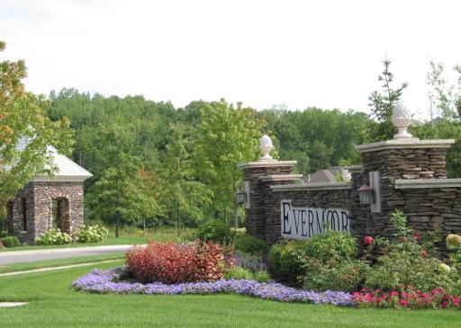 Stunning landscaping and a timeless stone entrance, straight out of a story book