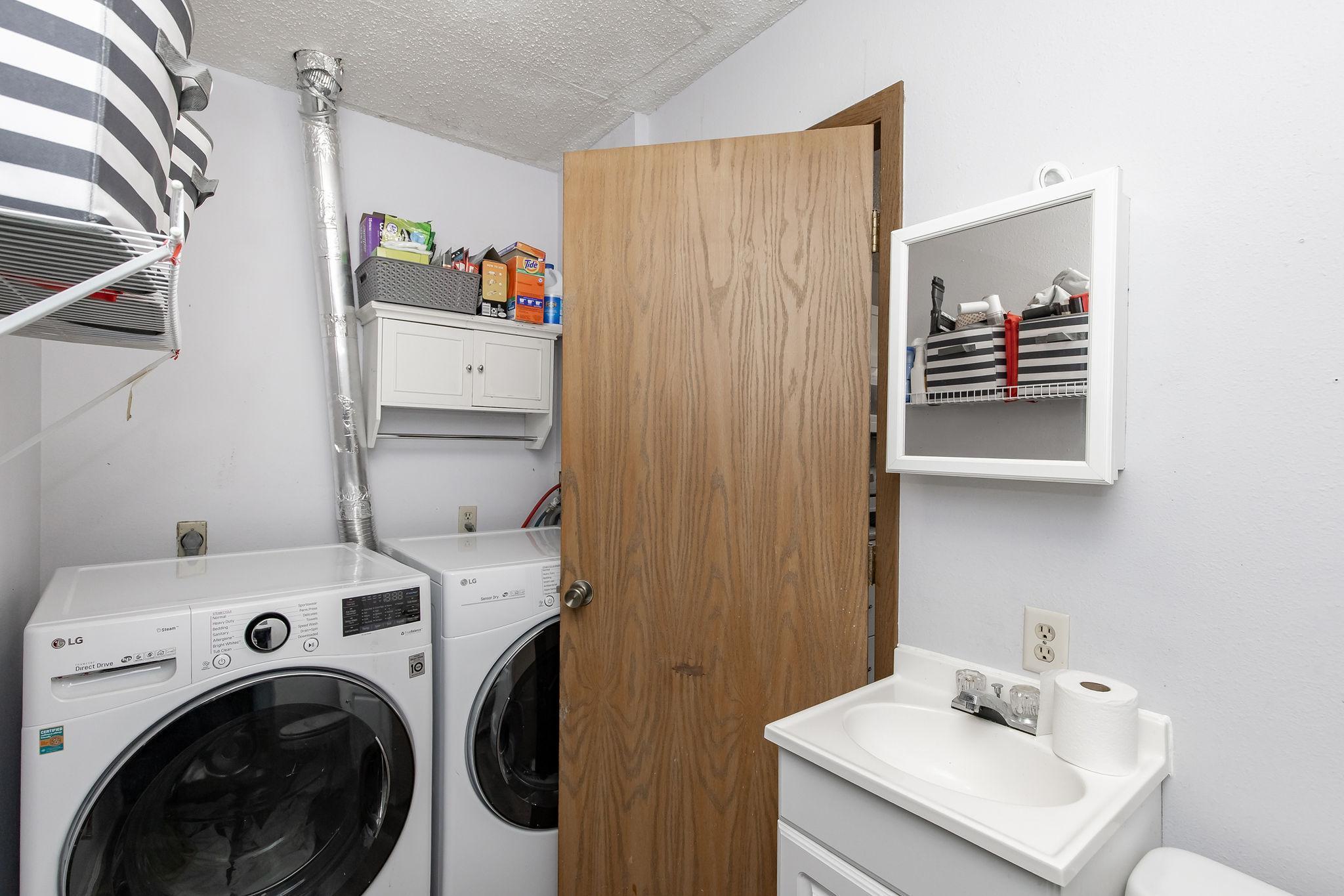 Laundry with half bath