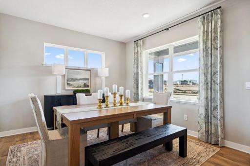 Formal dining room in the front of the home. Photo of a model home, color & options will vary.