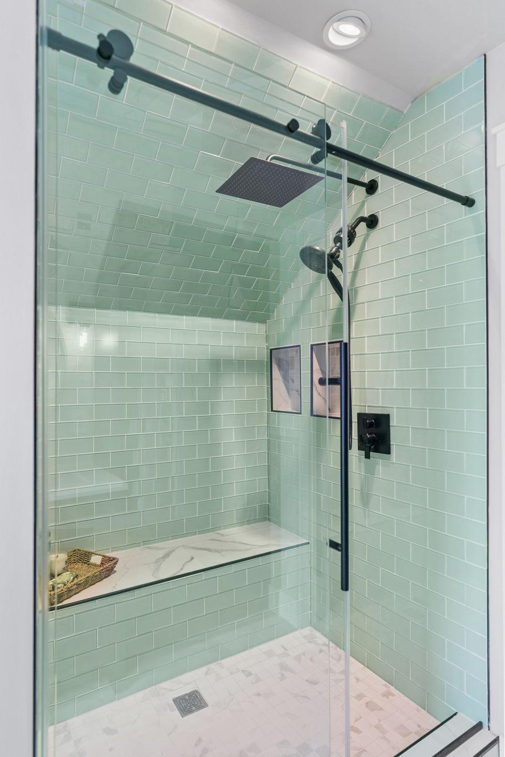 Shower includes a sitting bench