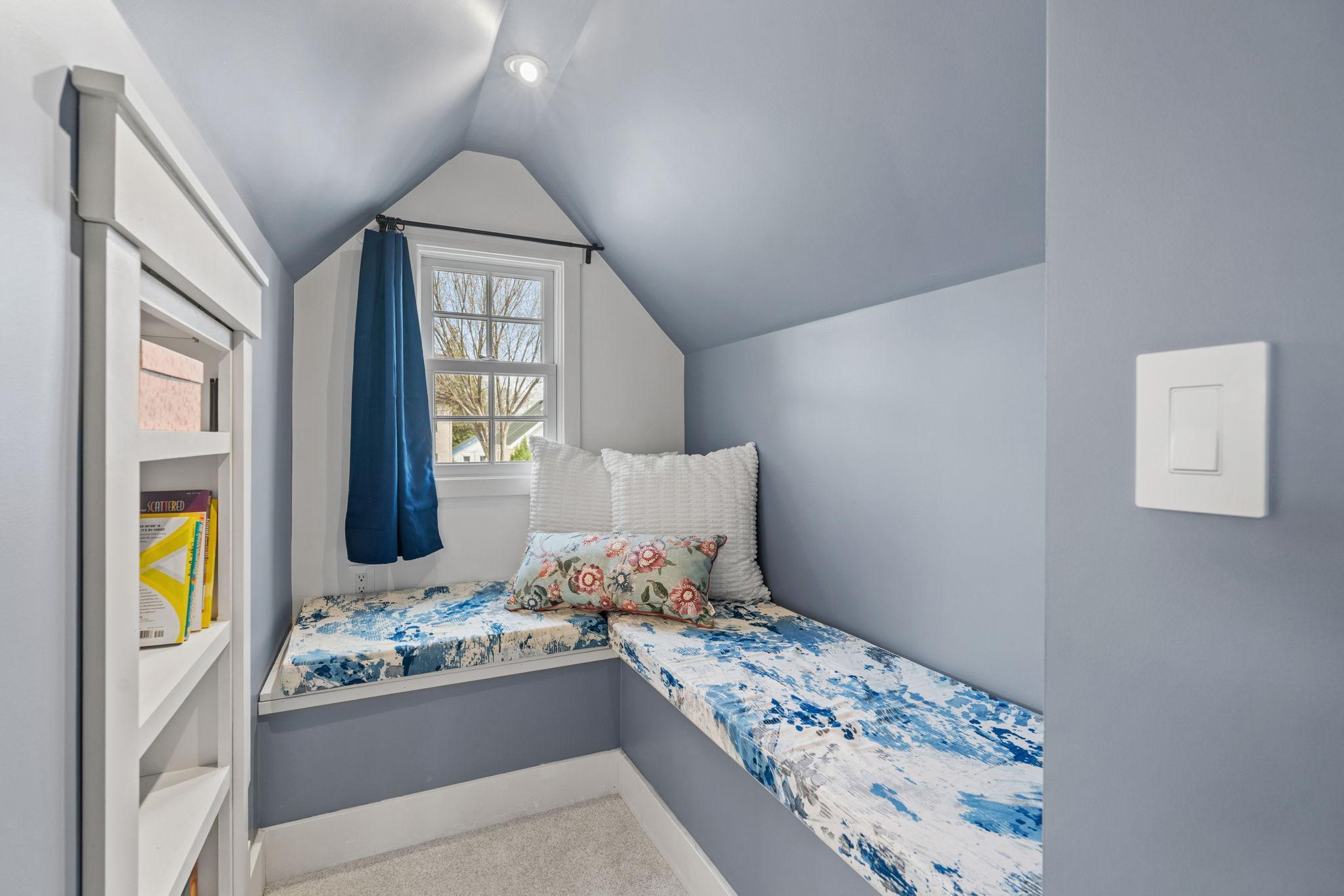 In addition, you'll find a charming reading nook up here