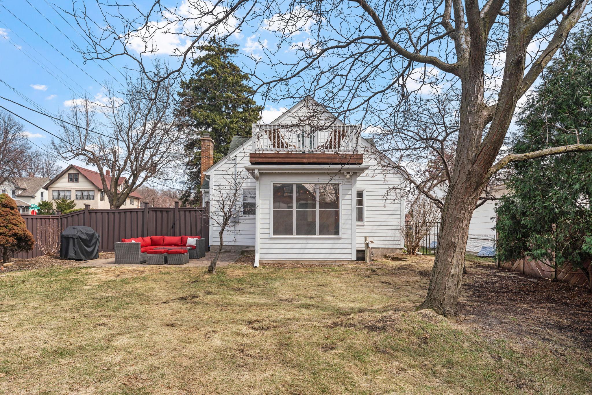 The lot is extra wide and offers wonderful green space