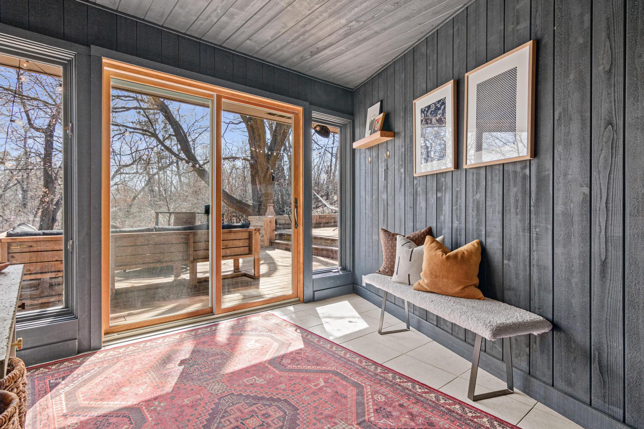 Equal parts functional and atmospheric, this entryway connects the interior to the newly refinished deck with an effortless flow.