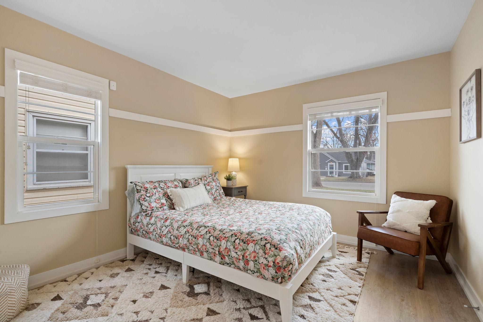 Main floor bedroom is spacious and sunny.