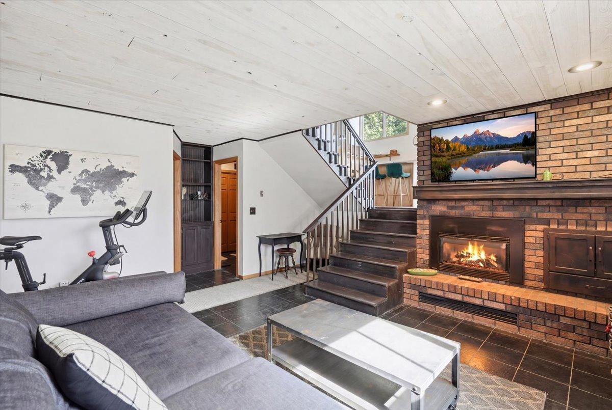 Stunning lower level family room with gas fireplace.