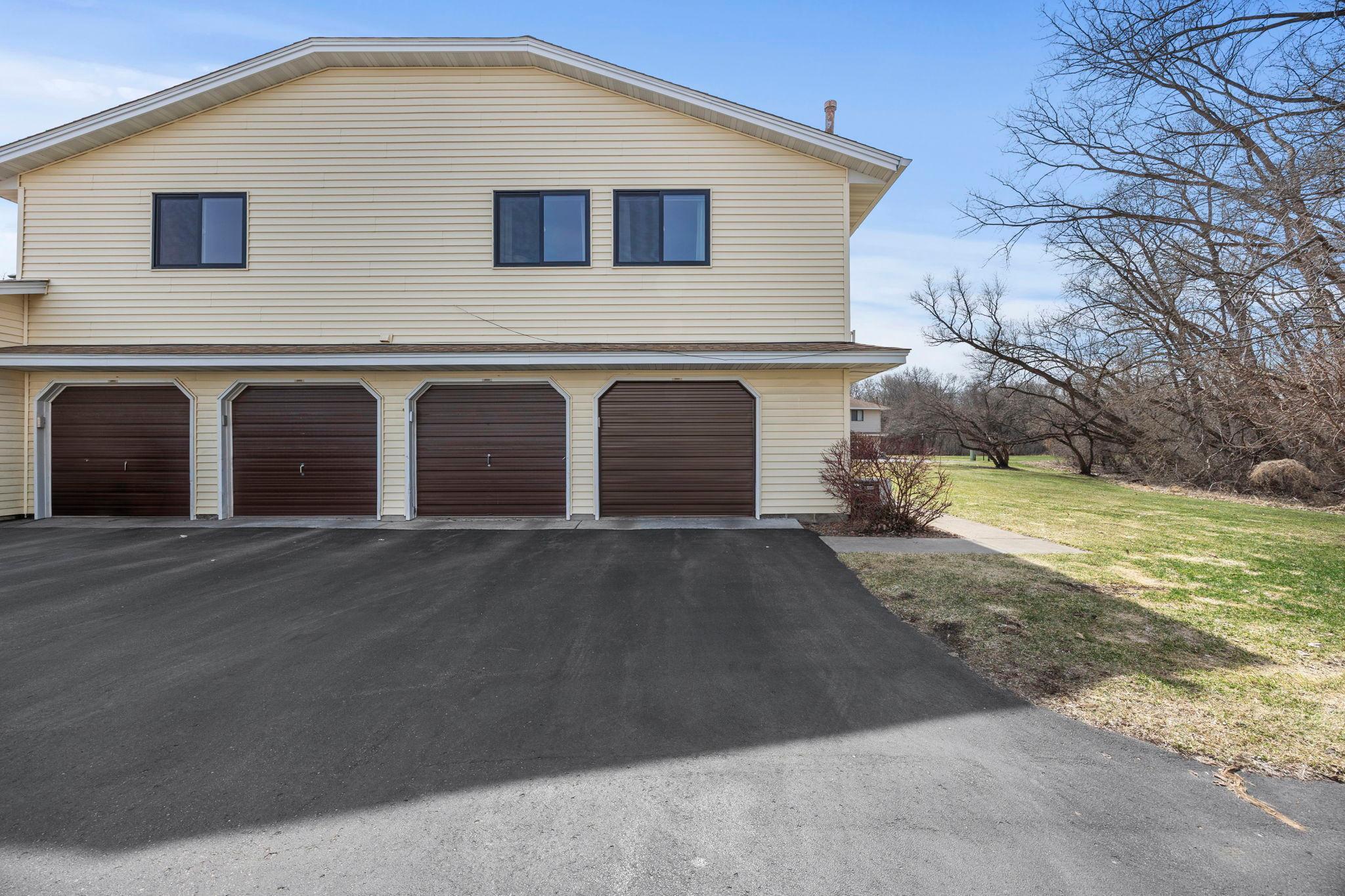 Single car garage with new door with front door around corner