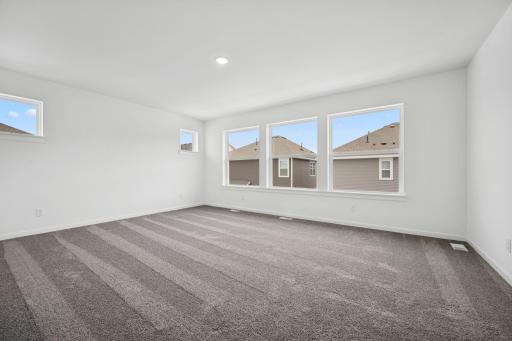 The expansive owner's suite: relax, recline, rest.. Pictures are of a previous Pryor home.