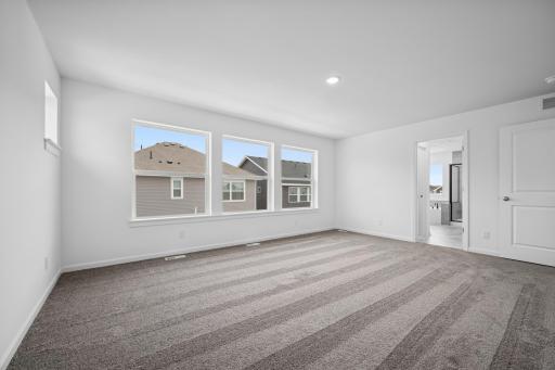 The owner's suite offers an en suite bath as well! Pictures are of a previous Pryor home.