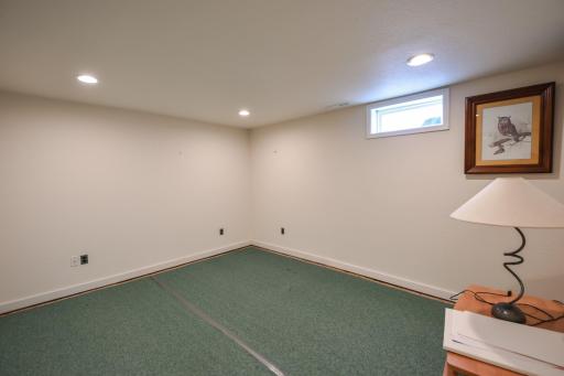 Lower level room, with can lights, nice and bright another great space to relax and make your own.