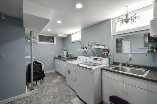 Lower level laundry room, with a floor drain.